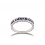 Ring with lateral white and central blue cubic zirconia